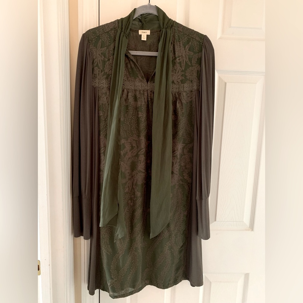 This dress has never been worn. So unique. Olive color. Size Large.